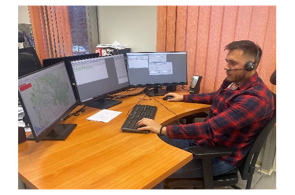 Stefan Sošić works at a desk with mutiple screens