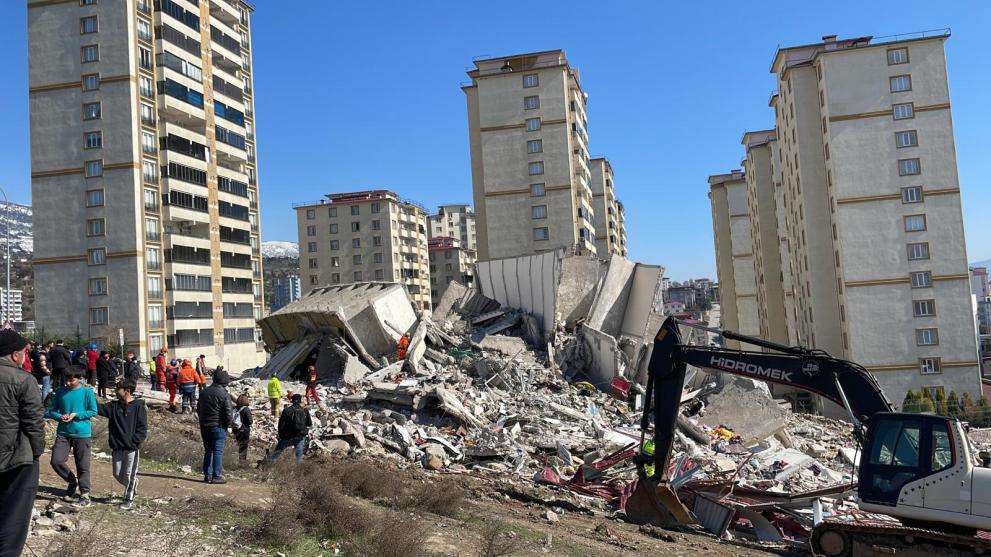 Work begins to clear parts of a collapsed apartment block