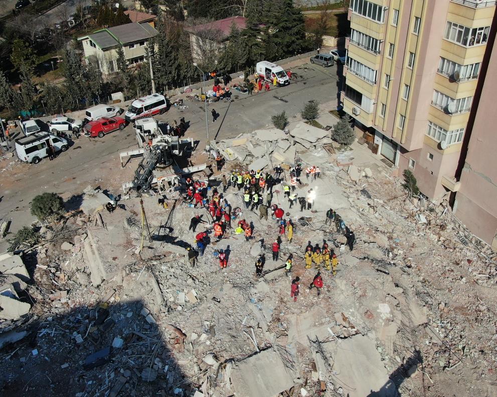 A shot from above of the remains of a destroyed apartment block