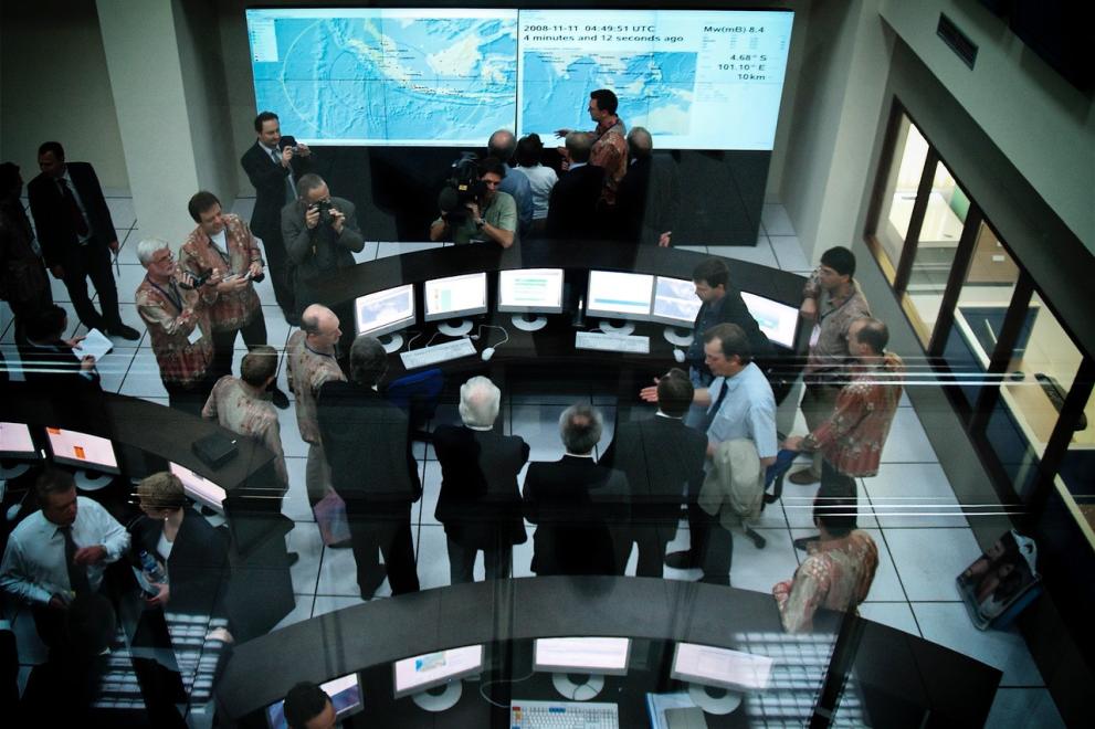 Birds-eye view of people gathered in a control center