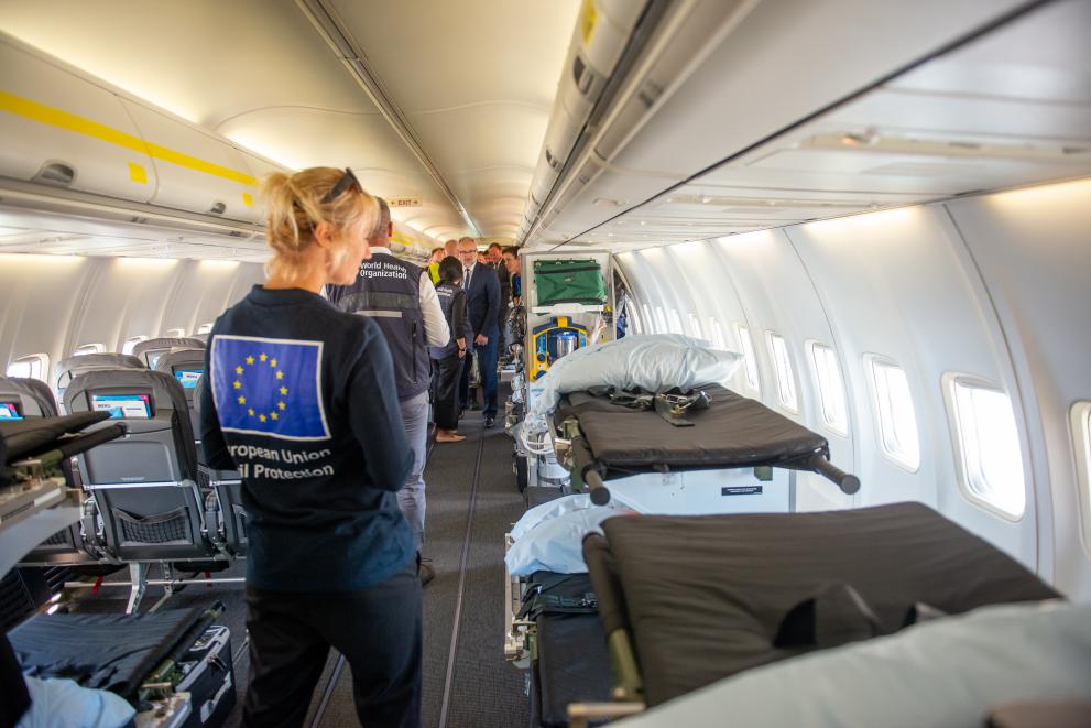 EU civil protection expert assessing the interior of a medical evacuation airplane