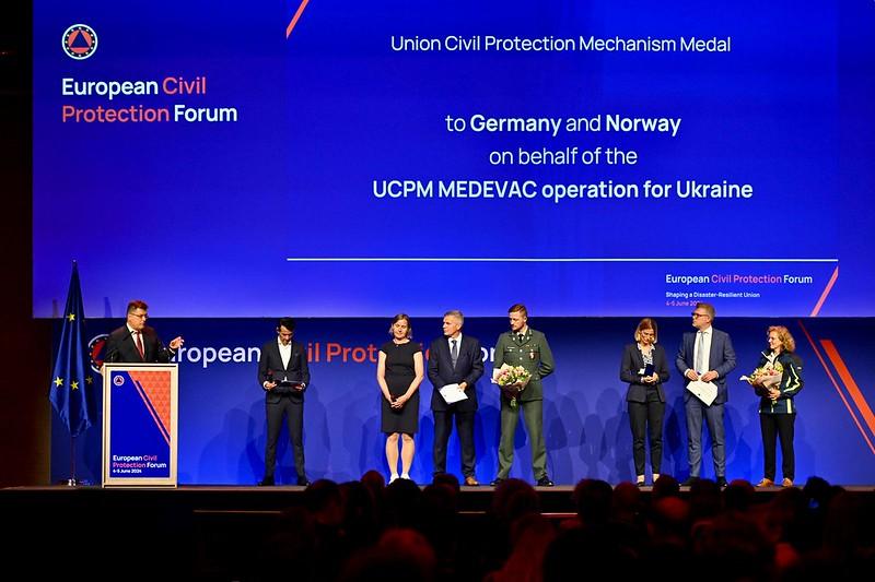 Teams from Germany and Norway accepted the medals on behalf of the entire operation