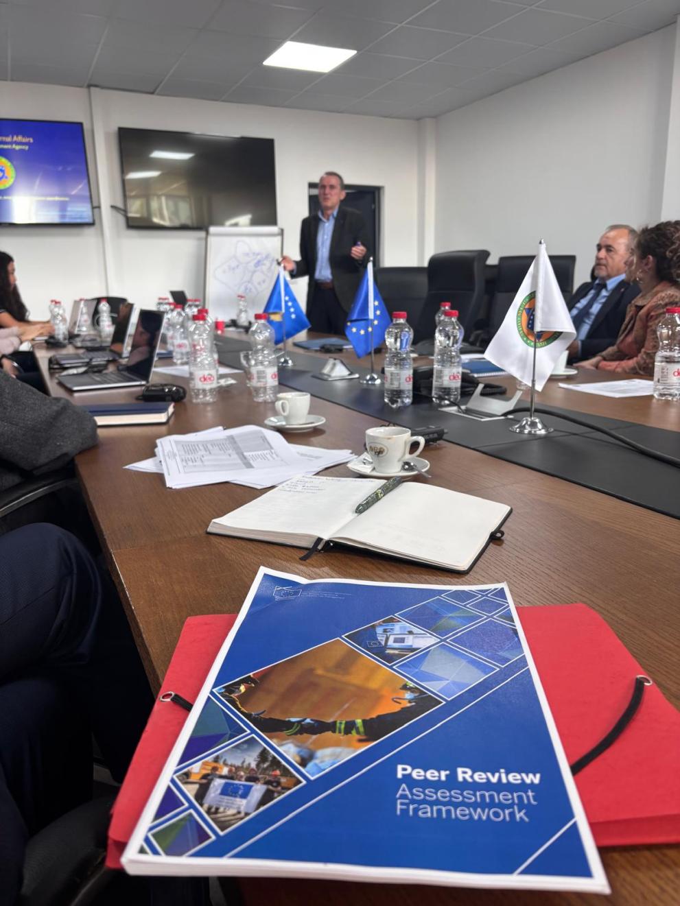 Participants around a table during the last Peer Review Assessment Workshop in Kosovo