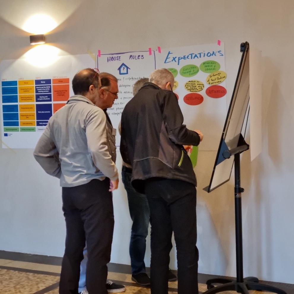 Four civil protection experts during a training exercise.