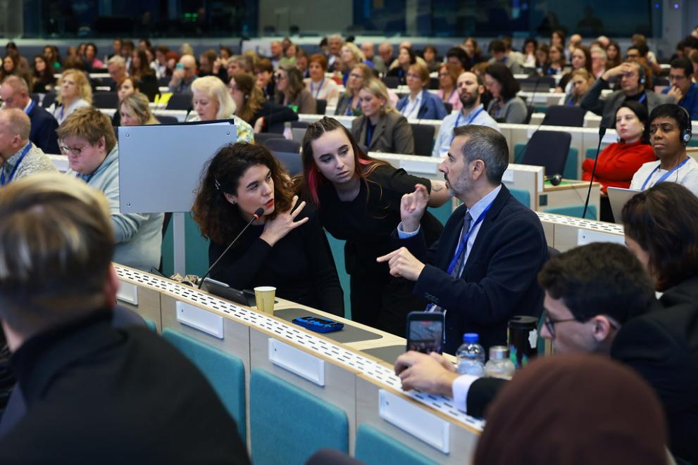 An audience member intervenes during the Q&A after the panel.
