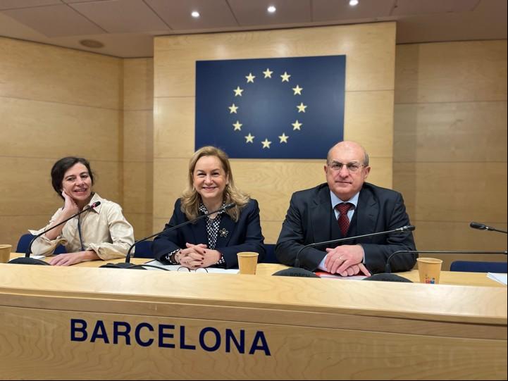 Speakers seated next to each other at the panel during the event.