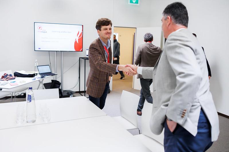 Handshake during one of the thematic workshops.