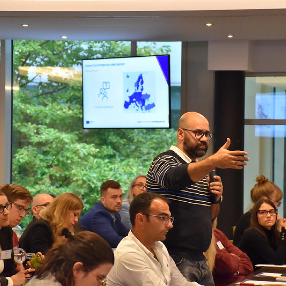 Attendees asking questions during the Union Civil Protection Mechanism (UCPM) session.