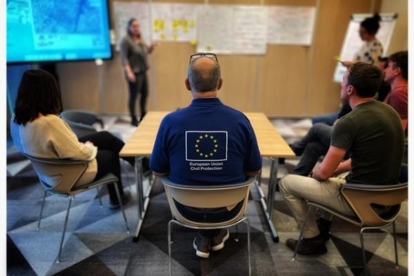 A group following a training session in a classroom