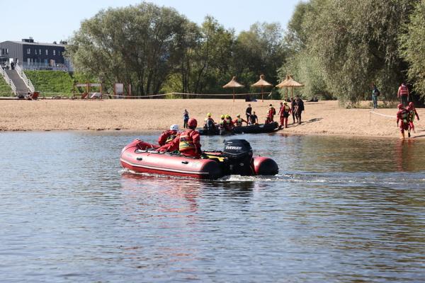 Boat with two responders on the water.