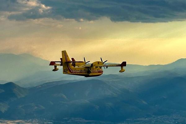 Canadairs, also known as water scoopers, are amphibious aircraft that skim the surface of water bodies to scoop up water into an onboard tank, which is then dropped over wildfires.