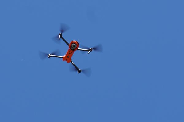 Drone flying over various areas.