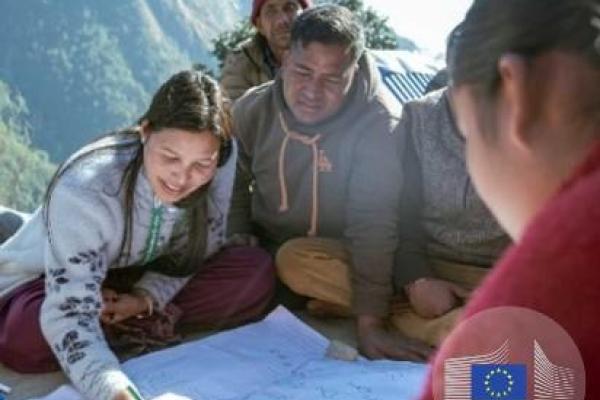 Women showing a plan during a workshop.