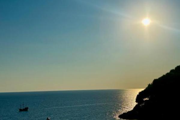 A view of the seaside during the sunrise.