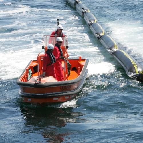 Crew deploying the rubber ring