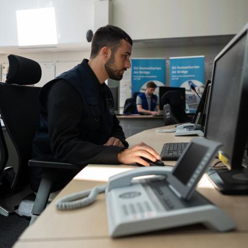 ERCC Duty Officer working at the Emergency Response Coordination Centre (ERCC)