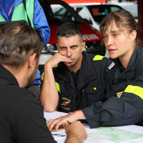 three first responders discussing
