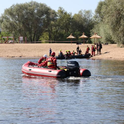 Boat with two responders on the water.