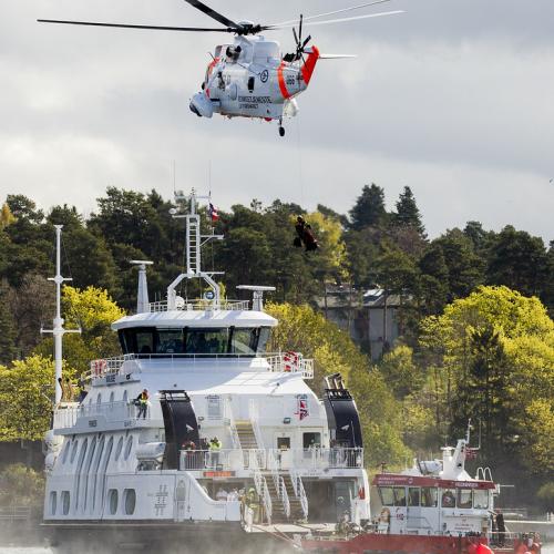 A rescue helicopter helps evacuating injured people from a ferry during the HarbourEx in Oslo, Norway, on April 29, 2015.