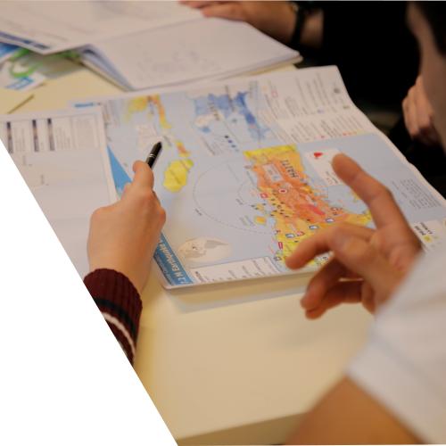 People looking at a Haiti emergency map during a workshop