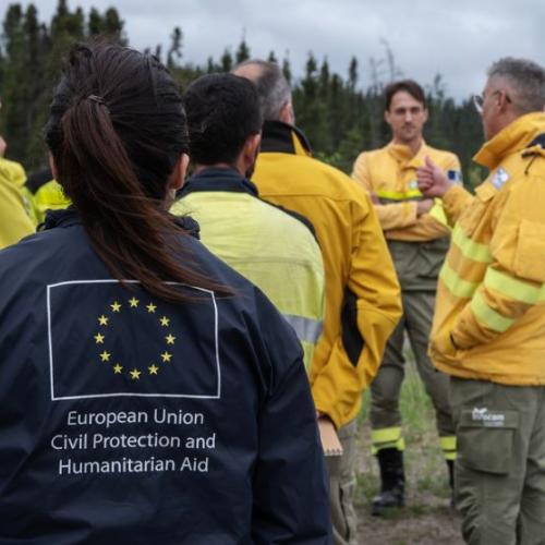 Spanish firefighters talk and get information for the coming days at their basecamp in Roberval, Quebec.