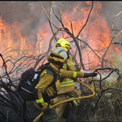 Firefighters fighting a fire in Spain
