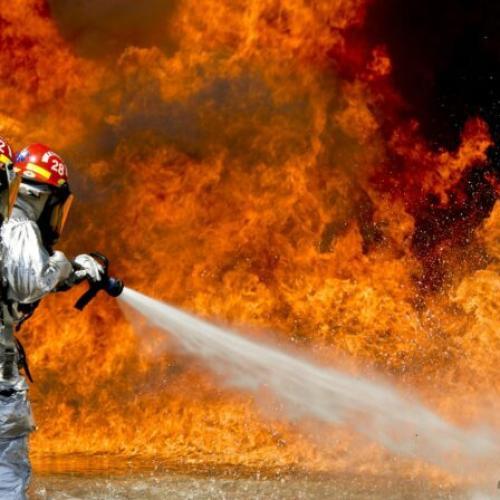Firefighter extinguishing a fire.