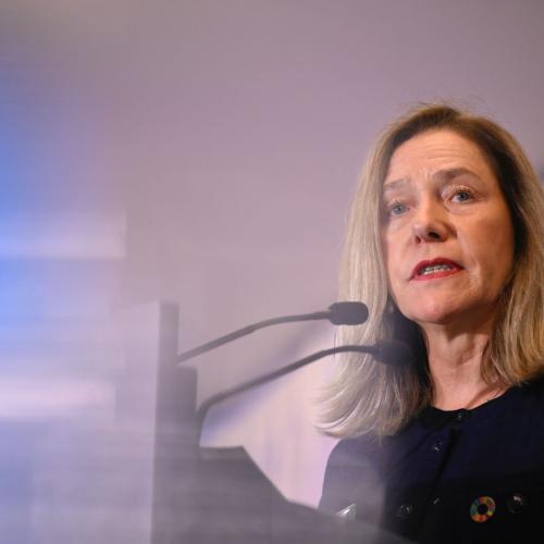 Celeste Saulo on stage, before a microphone, delivering her speech.