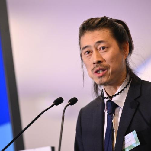 Chief DRR Unit, Soichiro Yasukawa  (UNESCO) during a keynote speech. This is a close up photo of him on stage.