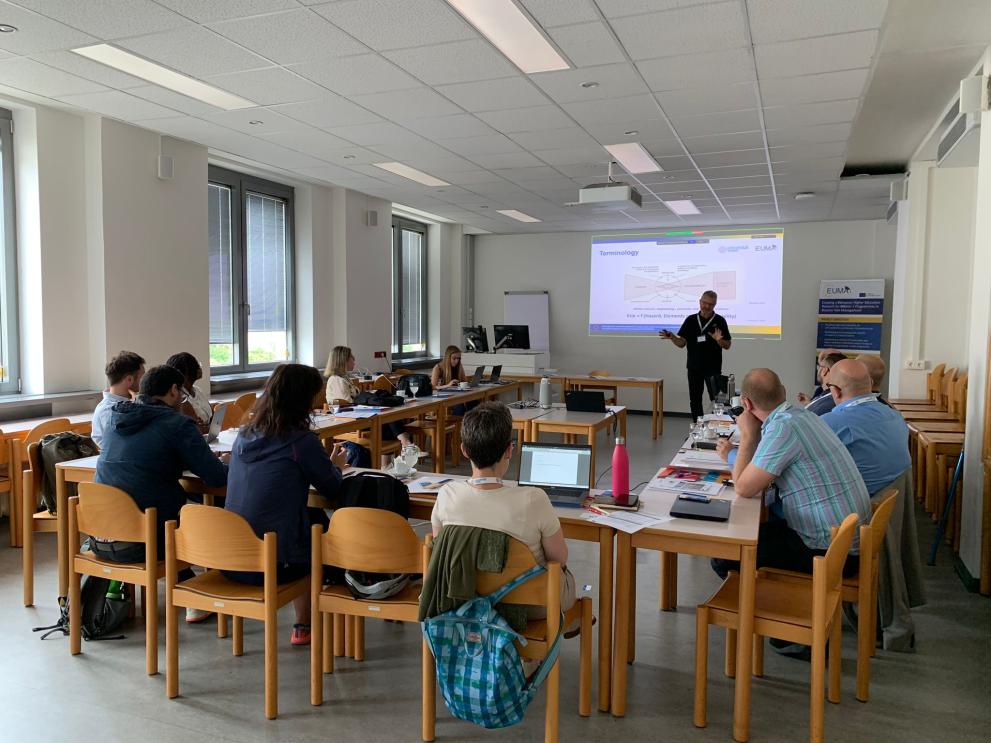 Prof. Thomas Glade giving a presentation in front of participants