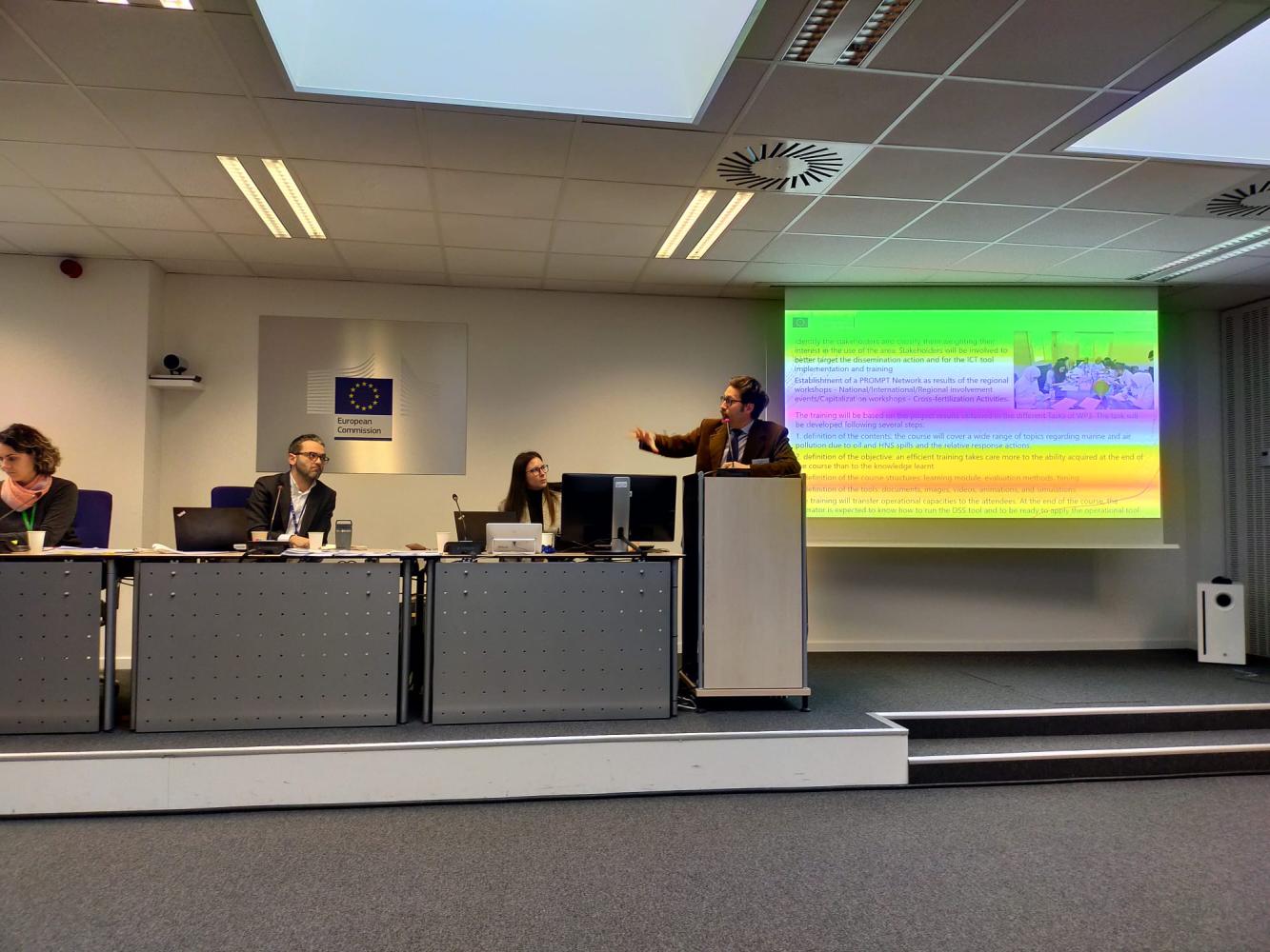 The image depicts Giovanni Besio, prompt project manager, presenting the project during the Kick-off meeting