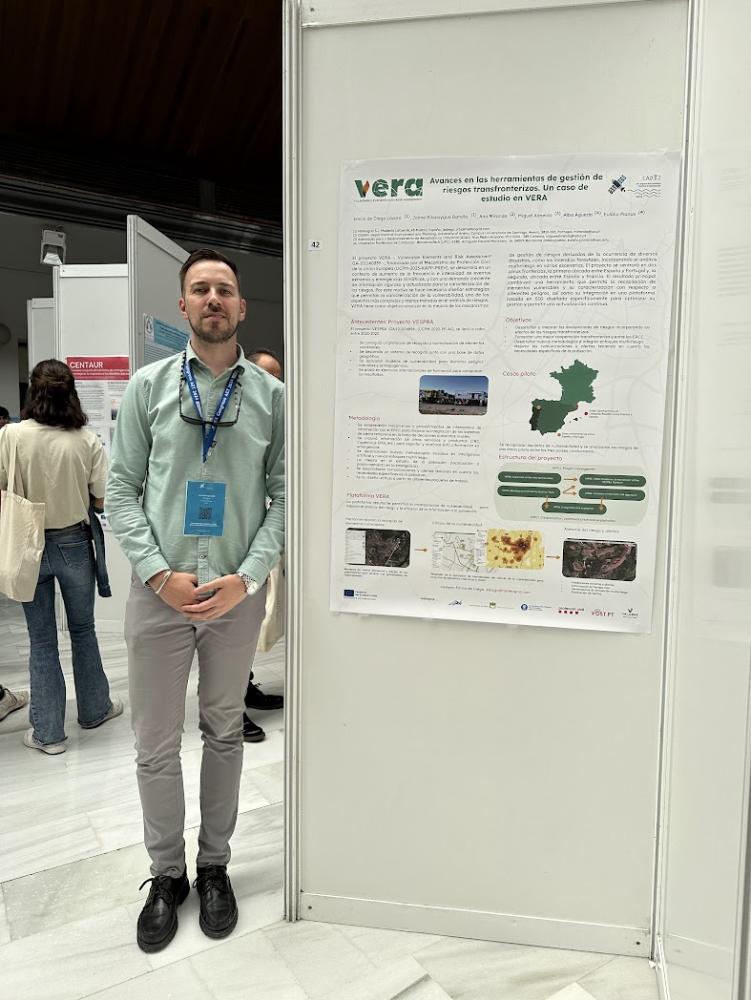 A photo of the poster with Emilio de Diego (METEOGRID) standing beside it. 