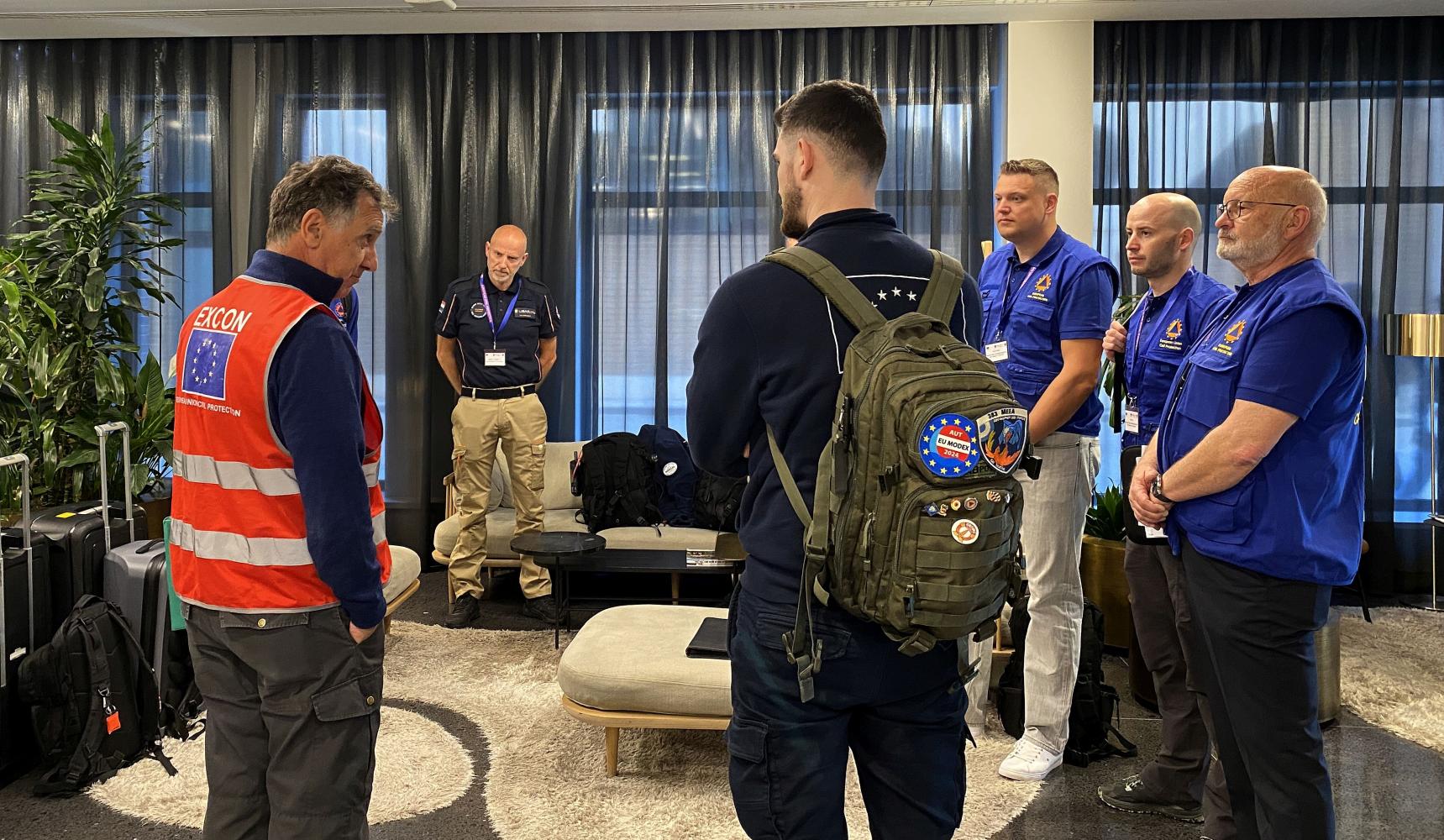 The EUCP Team receives the daily startex briefing from the chief exercise control.