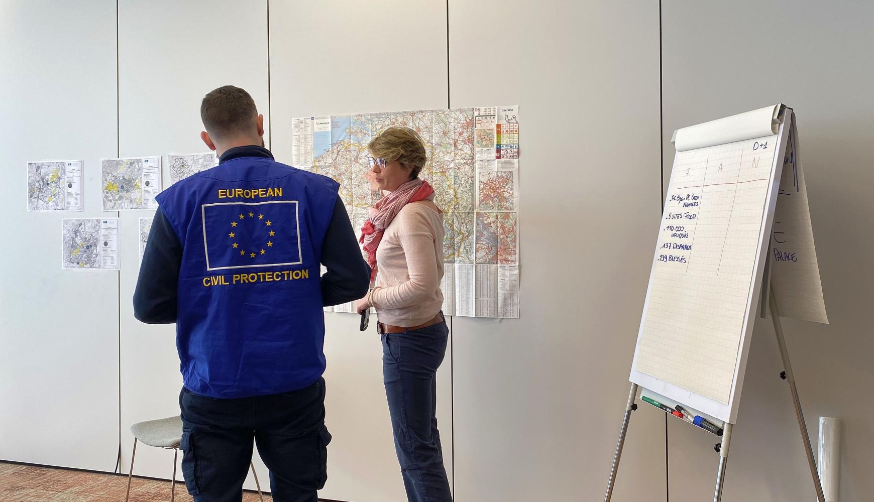 The EUCPT TL and ERCC LO meet with LEMA - looking at a map.