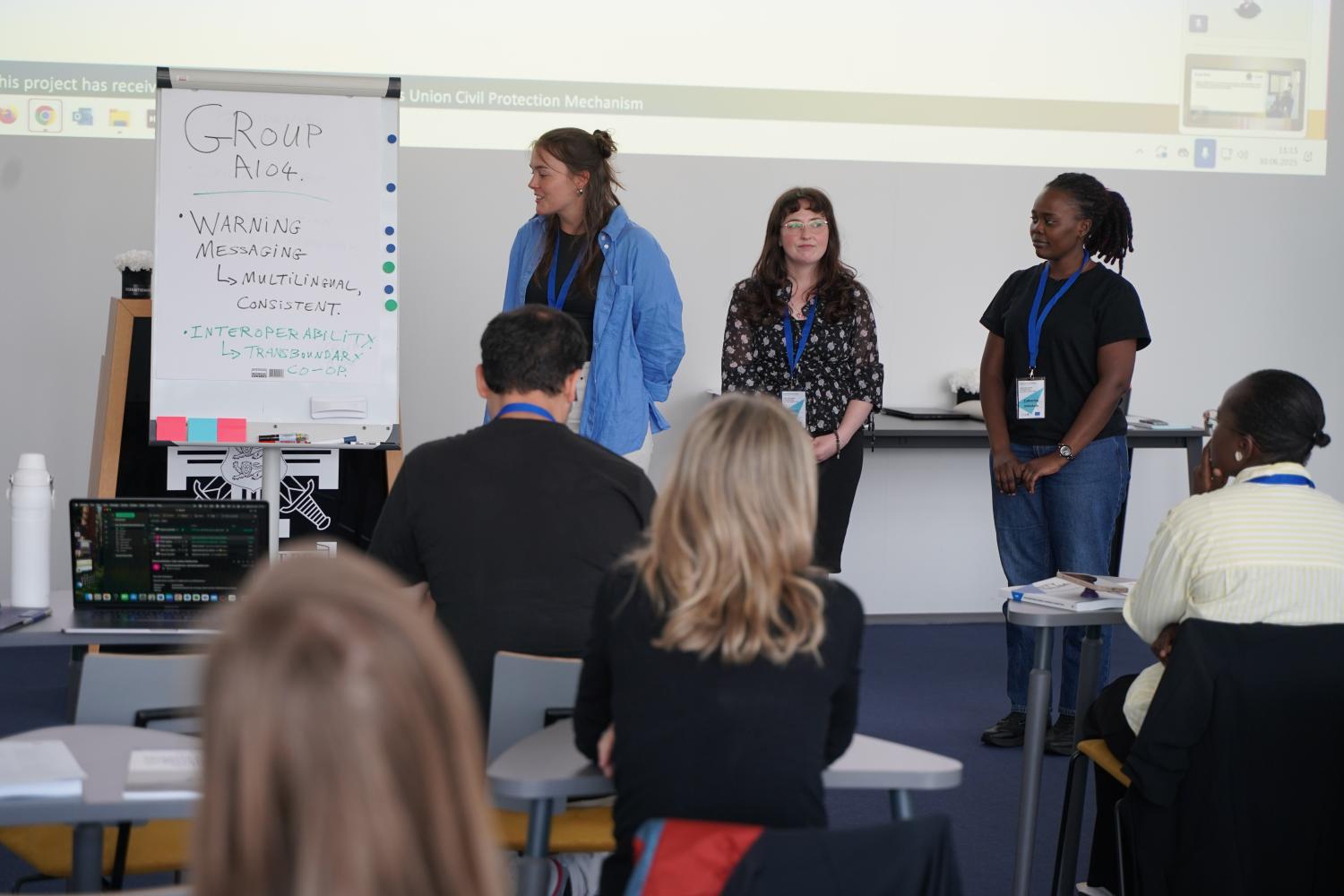 One of the four groups presenting their discussion results to the class.