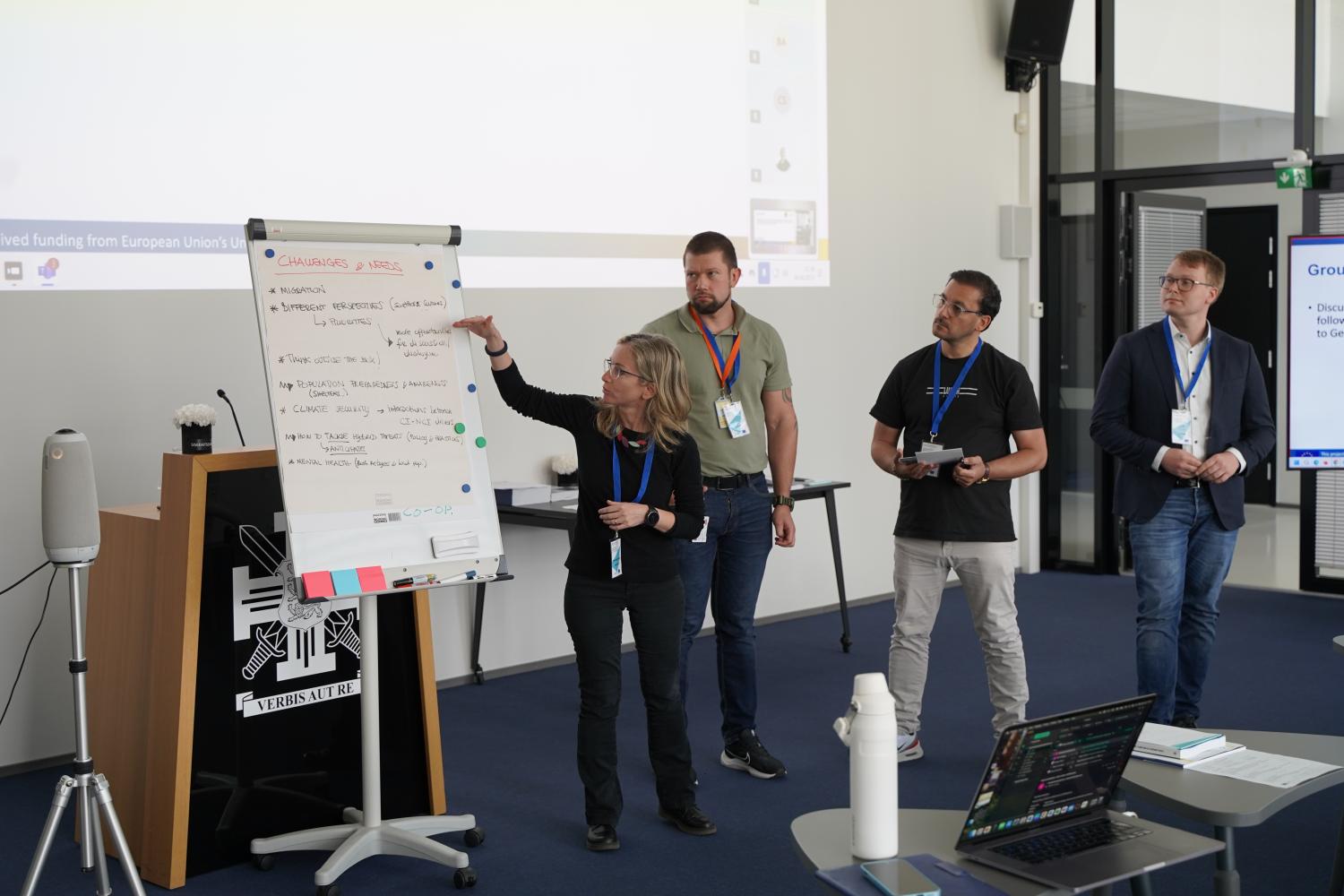 One of the four groups presenting their discussion results to the class.