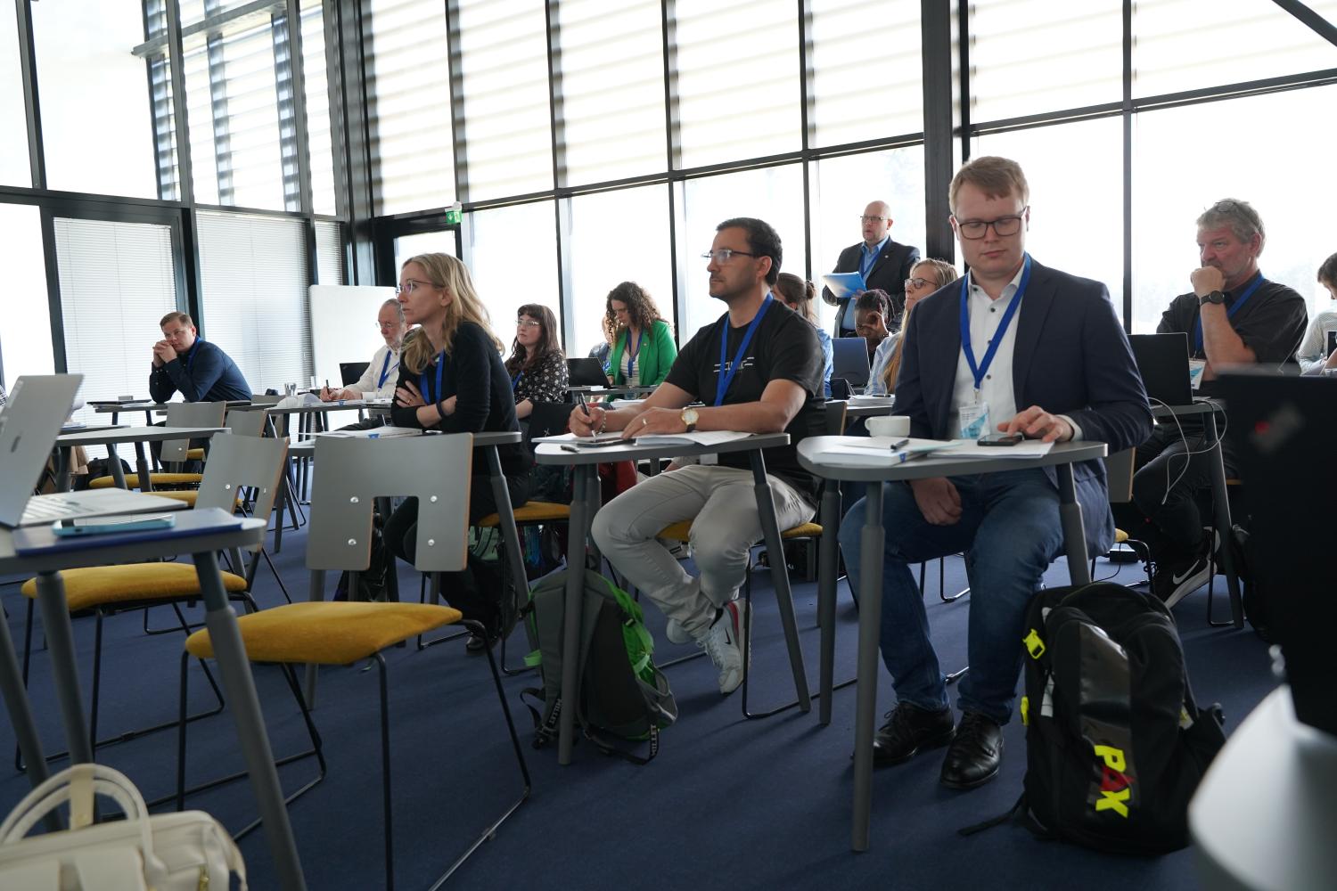 Workshop participants listening attentively to a presentation.