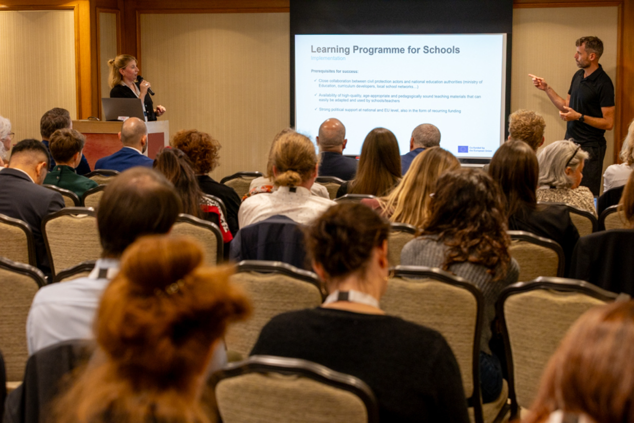 BE representative presents to the audience the concept 'Learning programme for schools" 