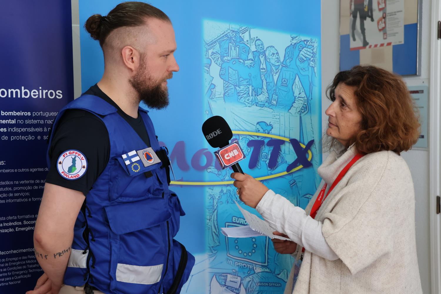 Participants are interviewed by local media (roleplayed in exercise).