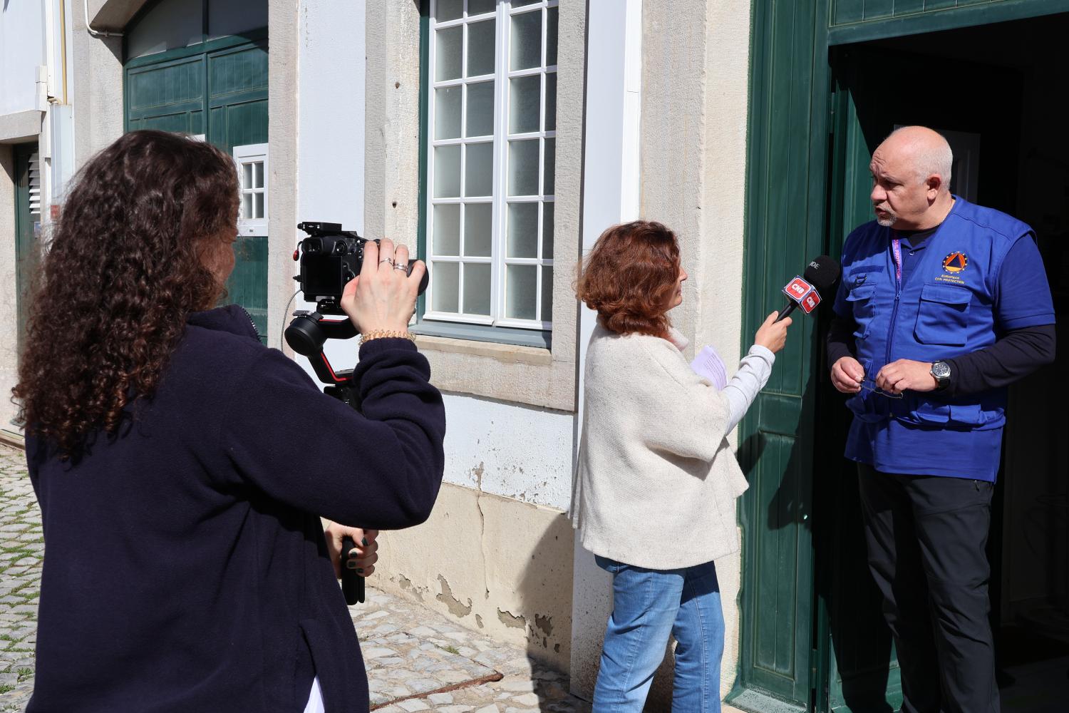 Participants are interviewed by local media (roleplayed in exercise).