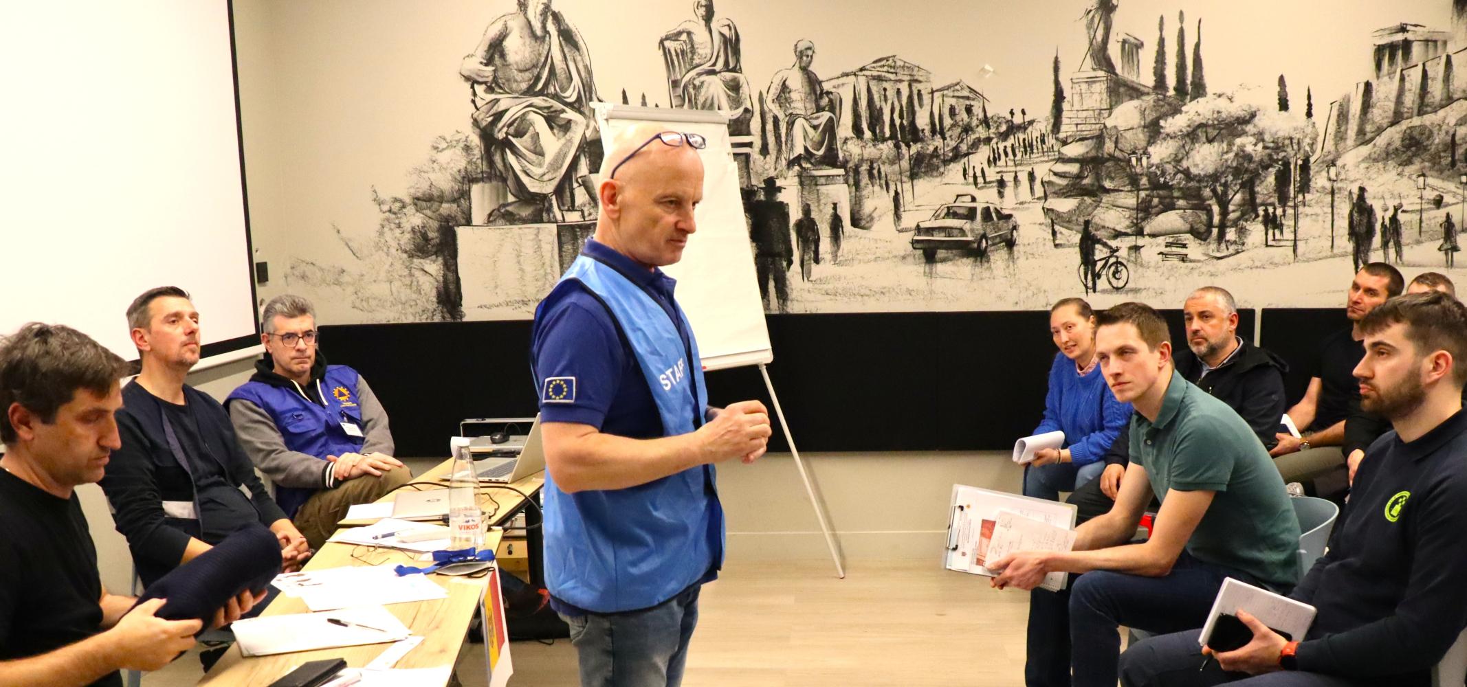 DCC course participants prepare for the simulation exercise with Course Director Andreas Hattinger of the Austrian Red Cross