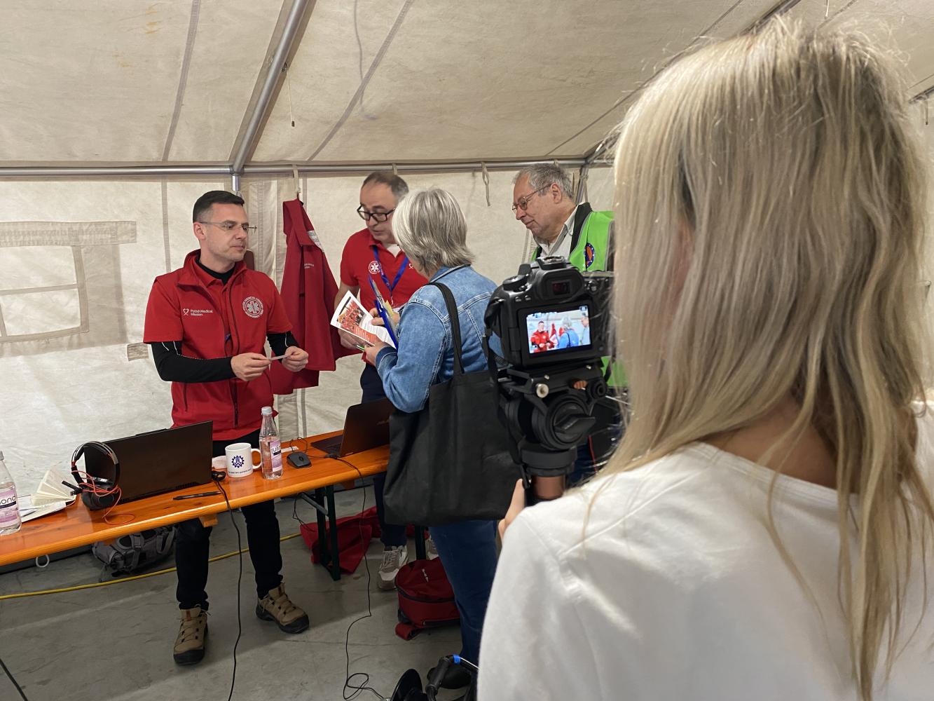 Participants are interviewed by the local media.