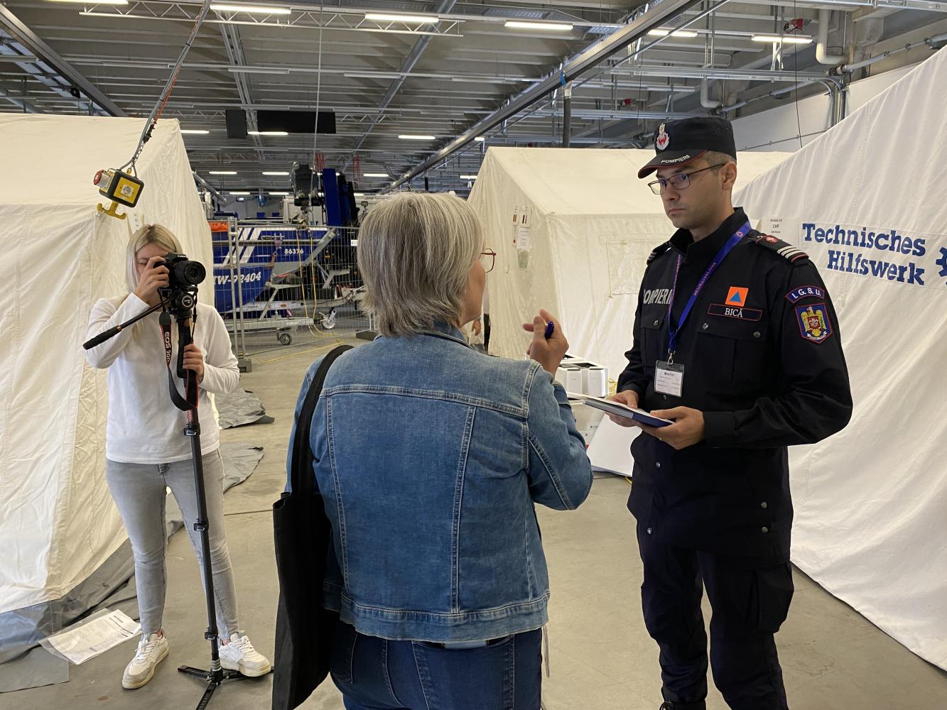 Participants are interviewed by the local media.