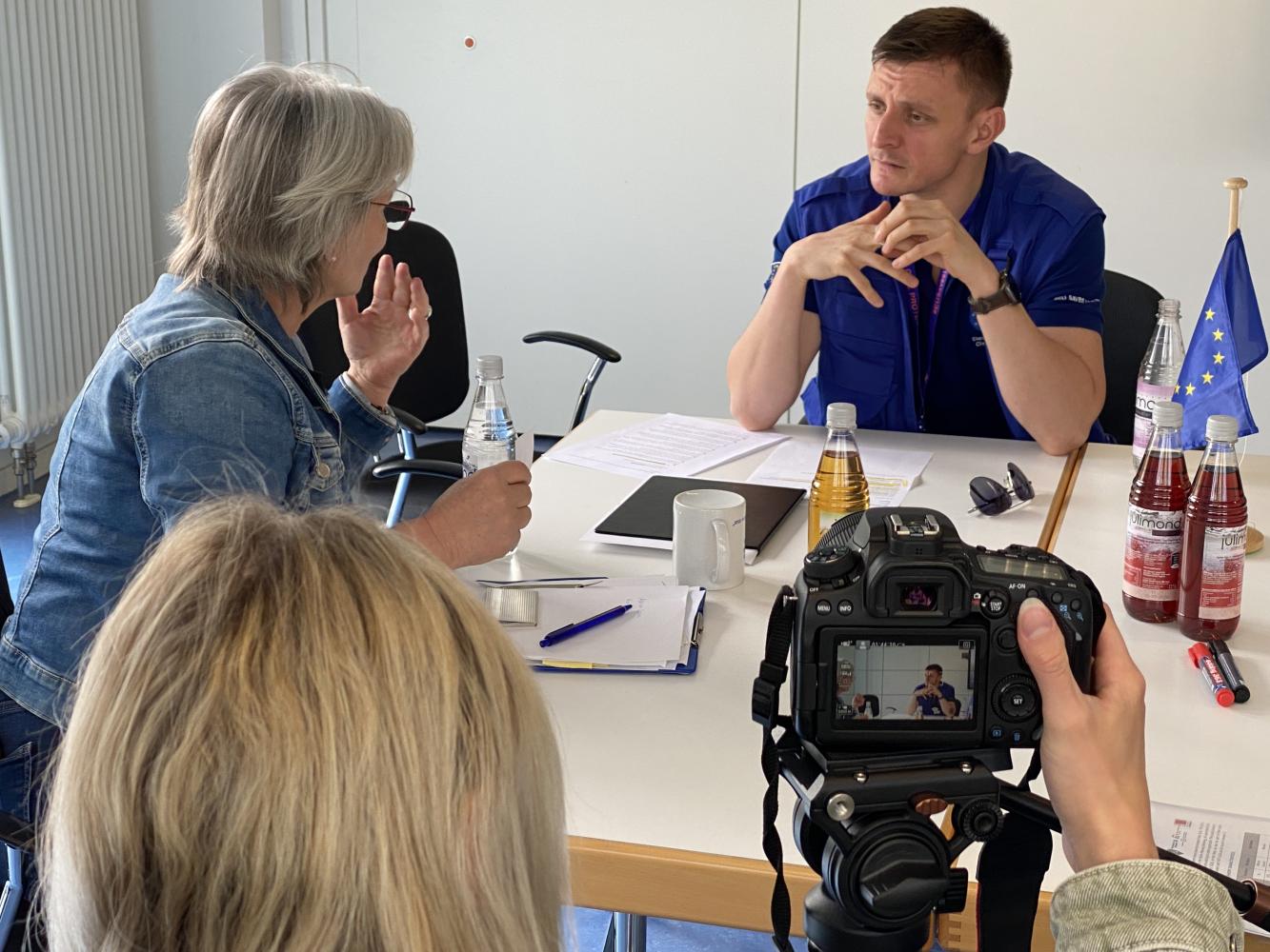 Participants are interviewed by the local media.