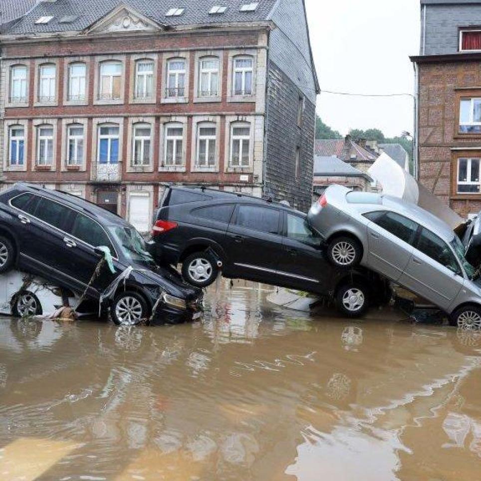 Cars pile up by the water at a roundabout in the Belgian city of Verviers after heavy rain and flooding hit western Europe. FRANCOIS WALSCHAERTS - AFP
