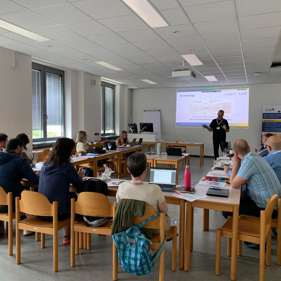 Prof. Thomas Glade giving a presentation in front of participants