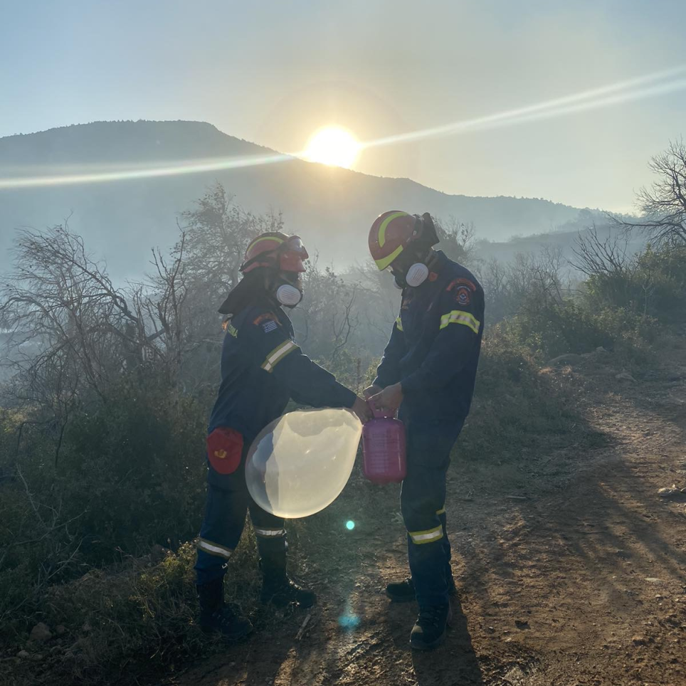 Firefighters from the HFS prepare a radiosonde for launching it during the 2024 Katsimidi fire, municipality of Acharnon, Greece, on 29 June 2024.
