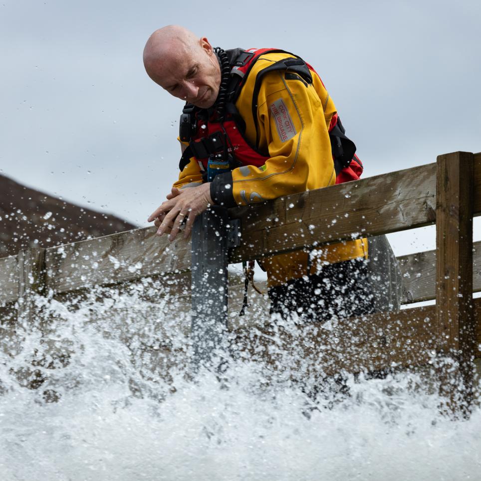 Fire fighter extinguishes fire