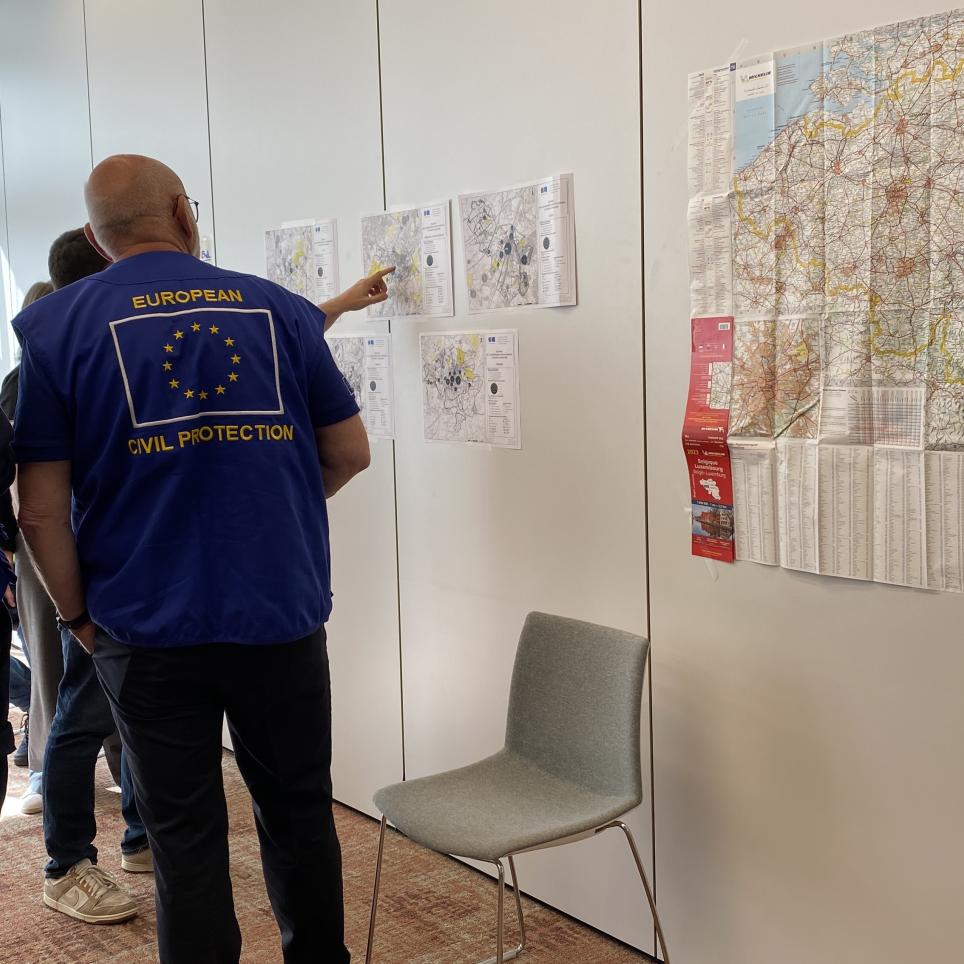 The EUCPT TL and ERCC LO meet with LEMA - looking at a map.