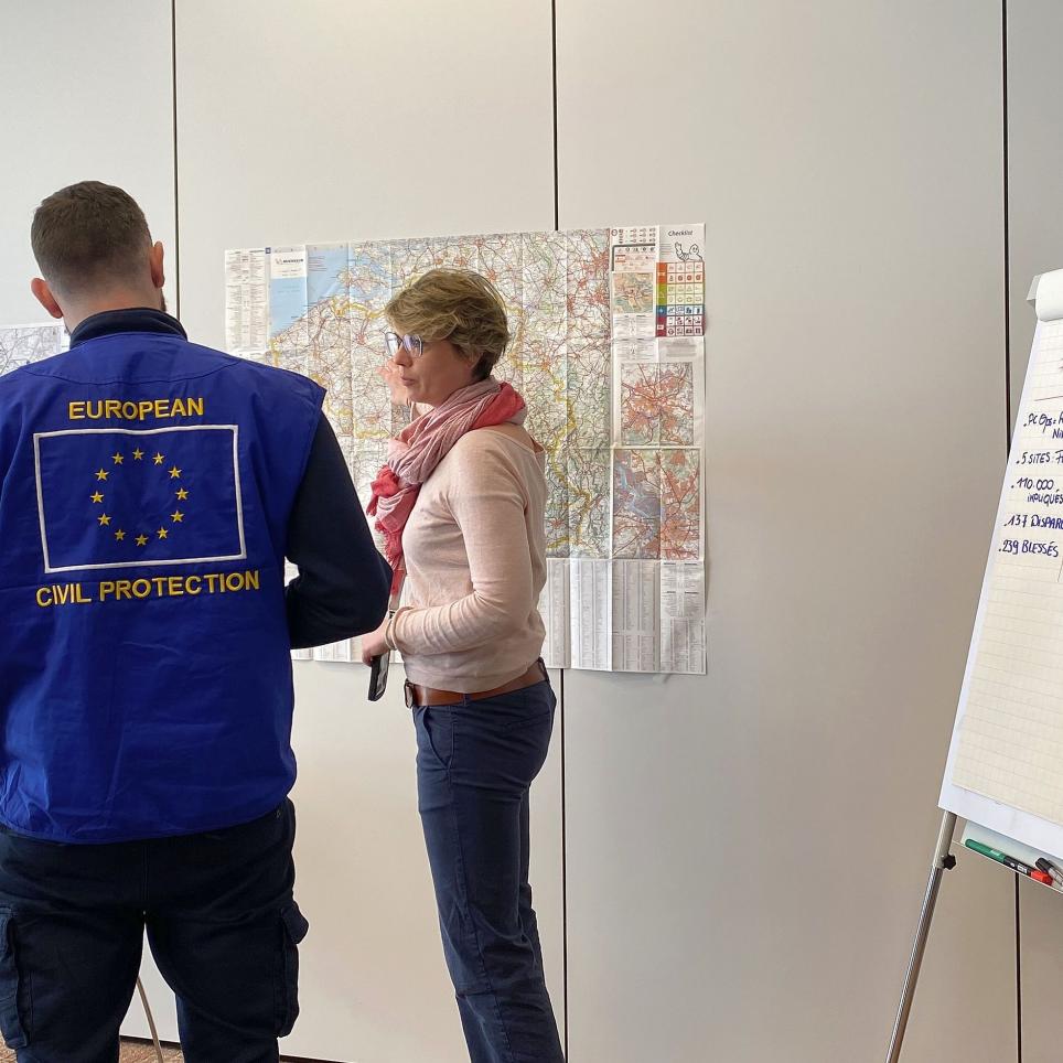 The EUCPT TL and ERCC LO meet with LEMA - looking at a map.